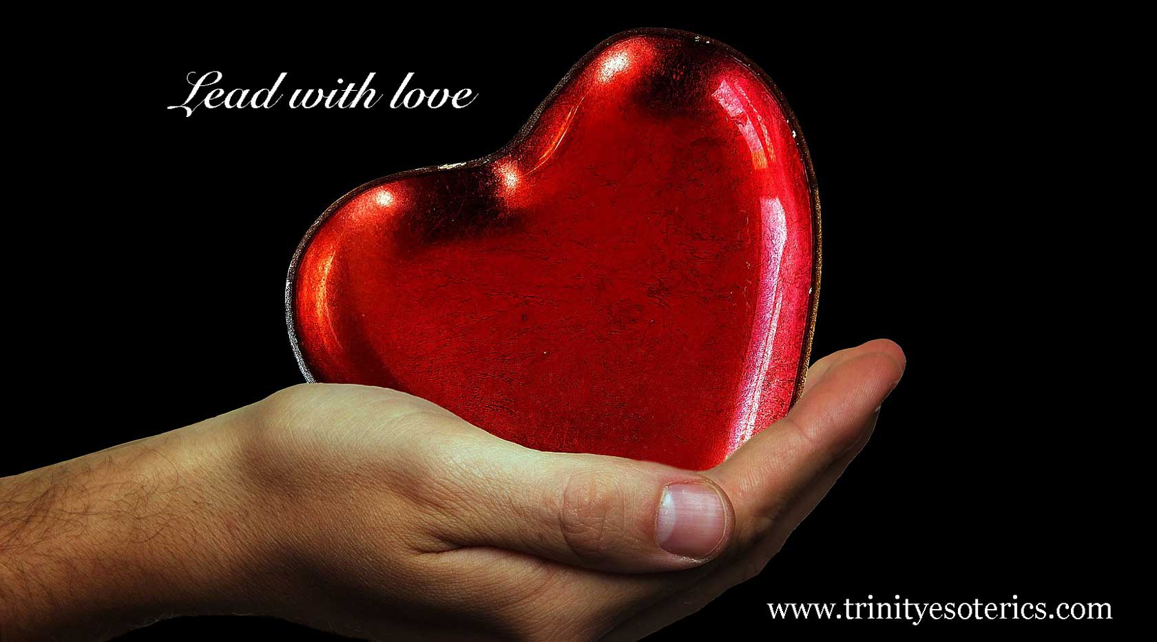 hand holding heart trinity esoterics