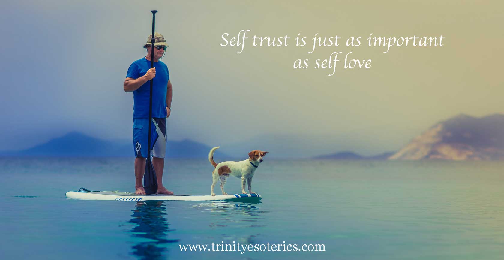 man on paddle board in calm waters with dog trinity esoterics