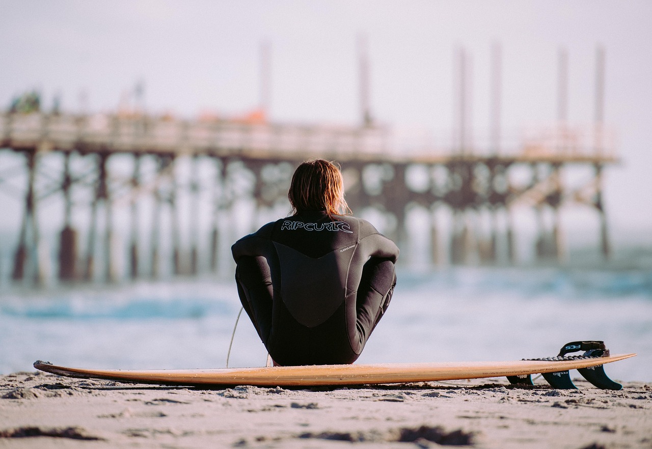 surfer on the shore trinity esoterics