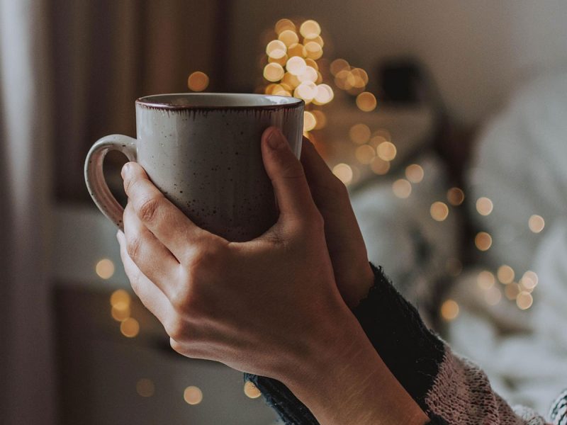 person with cup overflowing with light trinity esoterics
