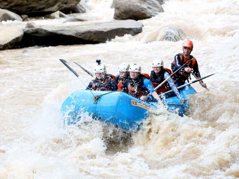 people in raft in rapids trinity esoterics