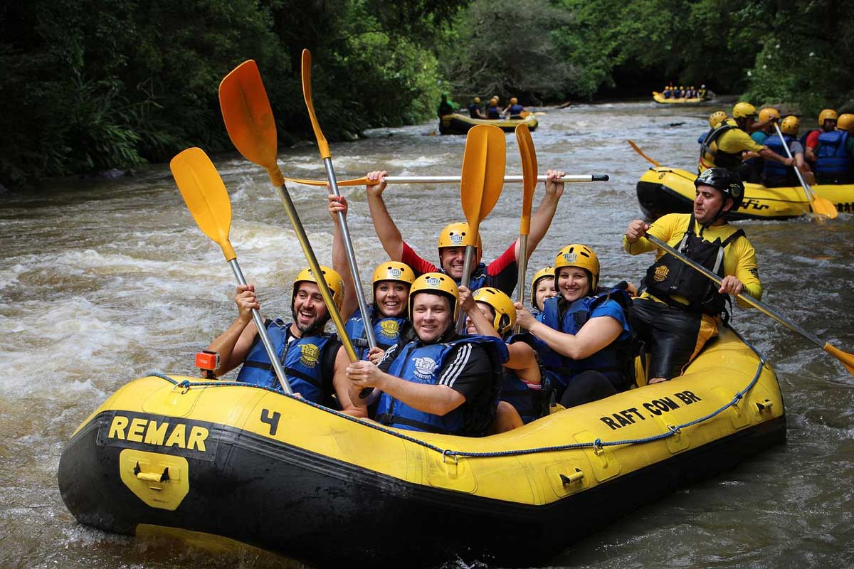 smiling people in raft trinity esoterics
