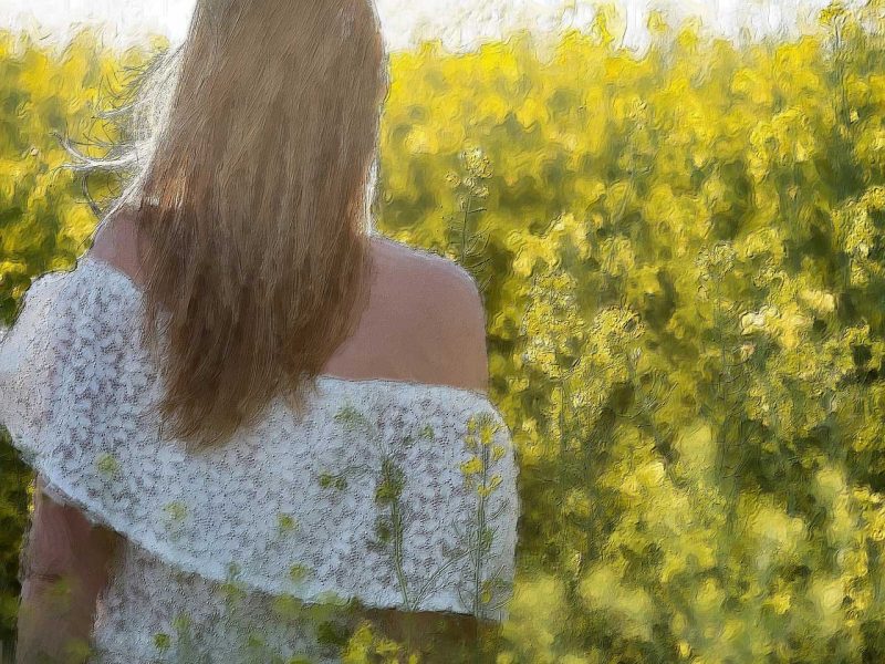 woman in field of flowers trinity esoterics