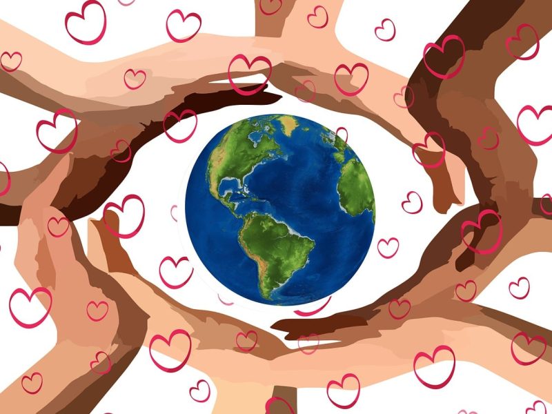 hands holding the planet trinity esoterics