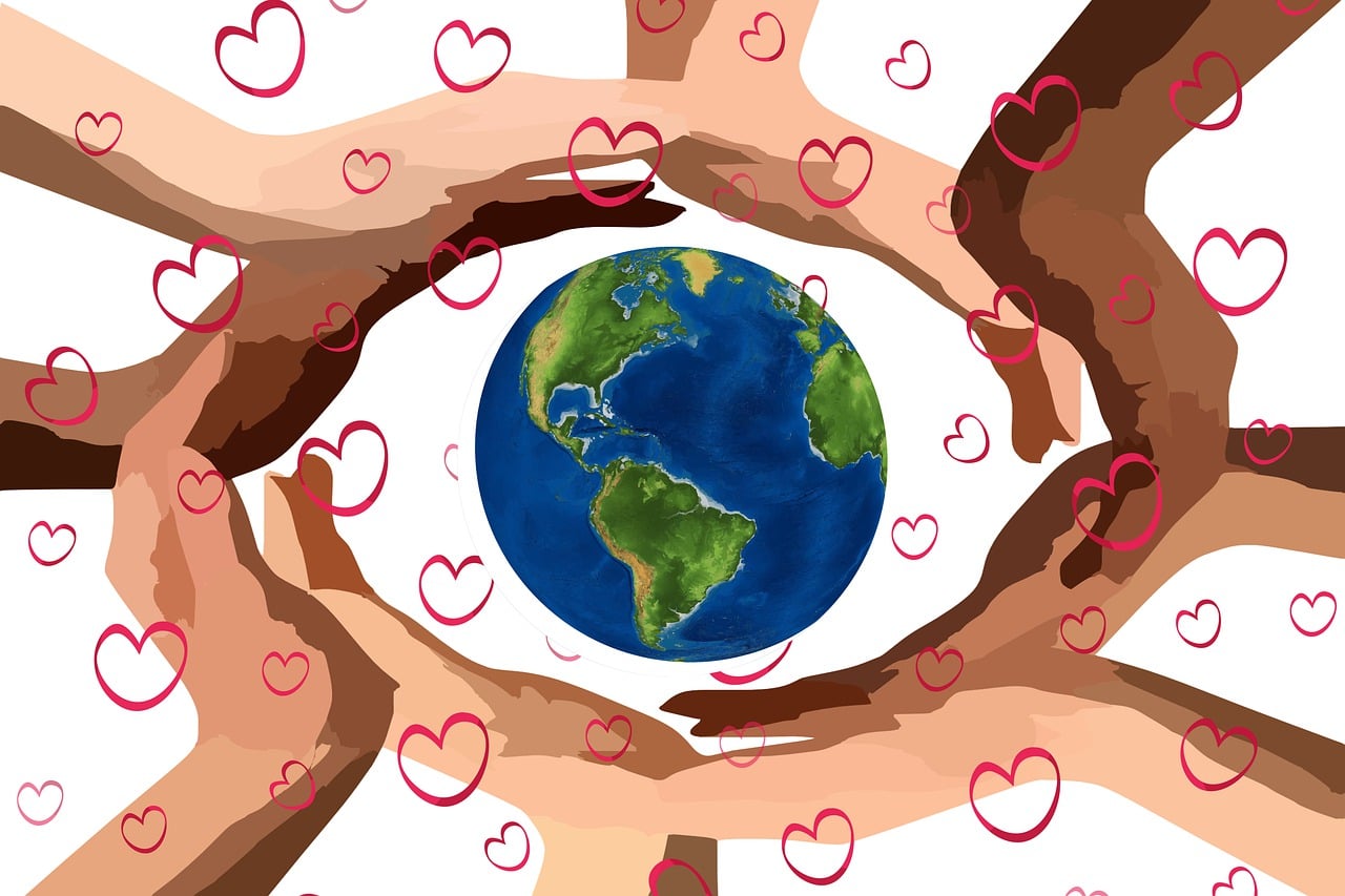 hands holding the planet trinity esoterics